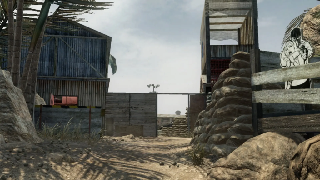 Firing Range in Call Of Duty Black Ops image of a desert ground and several steel buildings with sandbags