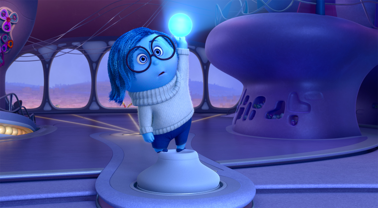 Sadness holds up a blue lightbulb