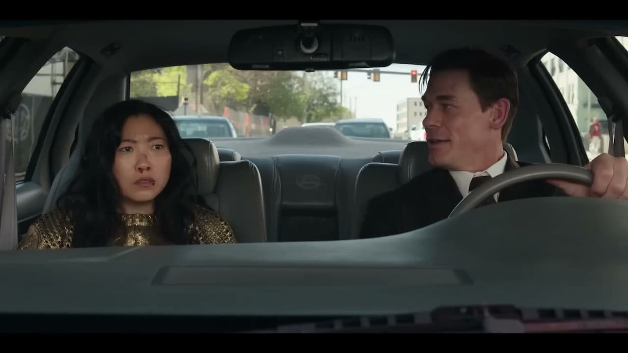 John Cena and Awkwafina in a car in Jackpot