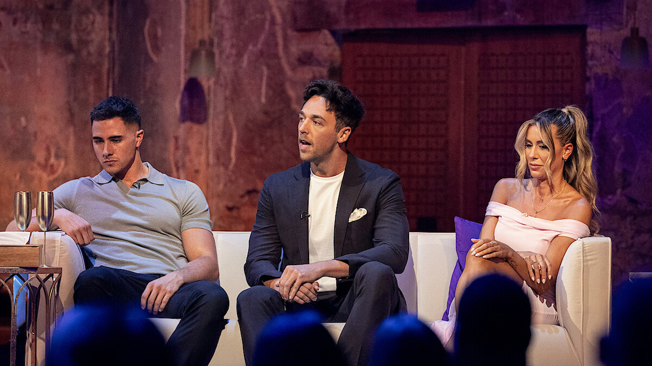 Love is Blind: UK, three cast members sitting together in chairs.