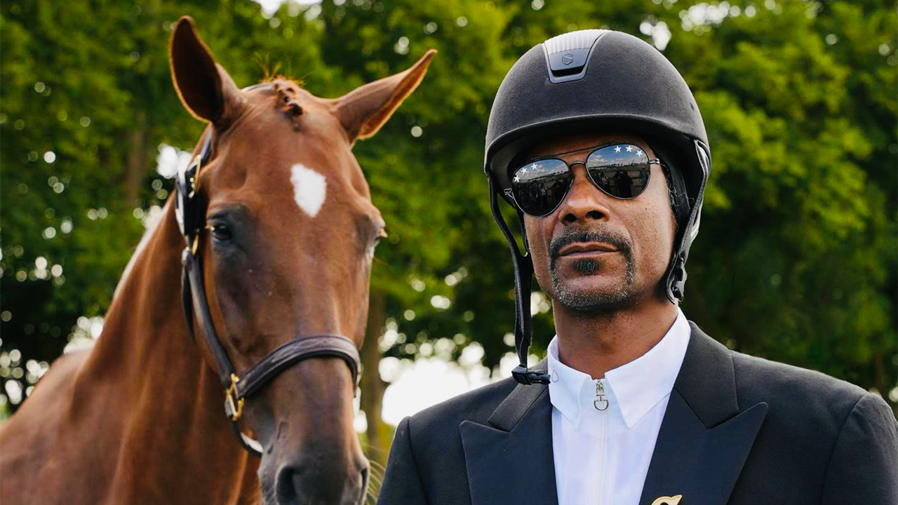 The 2024 Paris Olympic Games, with Snoop Dogg standing by a horse in full dressage.