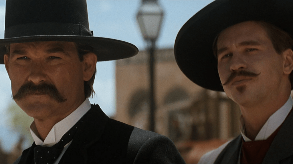 Wyatt Earp and Doc Holliday stand together