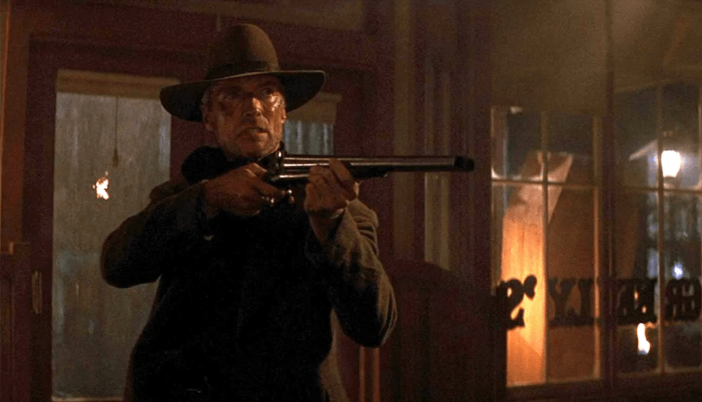 Will enters a saloon brandishing a rifle