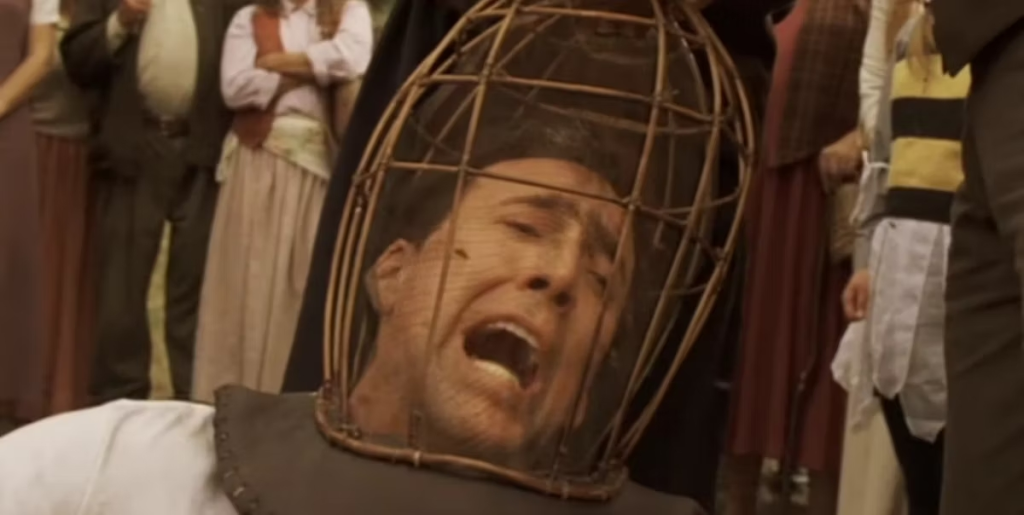 Nicolas Cage is tortured by bees as part of an article about the best horror movies that are so bad they're good.