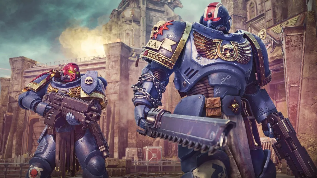 Image of two Space Marines in blue armor standing outside the walls of a citadel, one with a chainsaw blade in hand, the other with an assault rifle in Warhammer 40k Space Marine 2