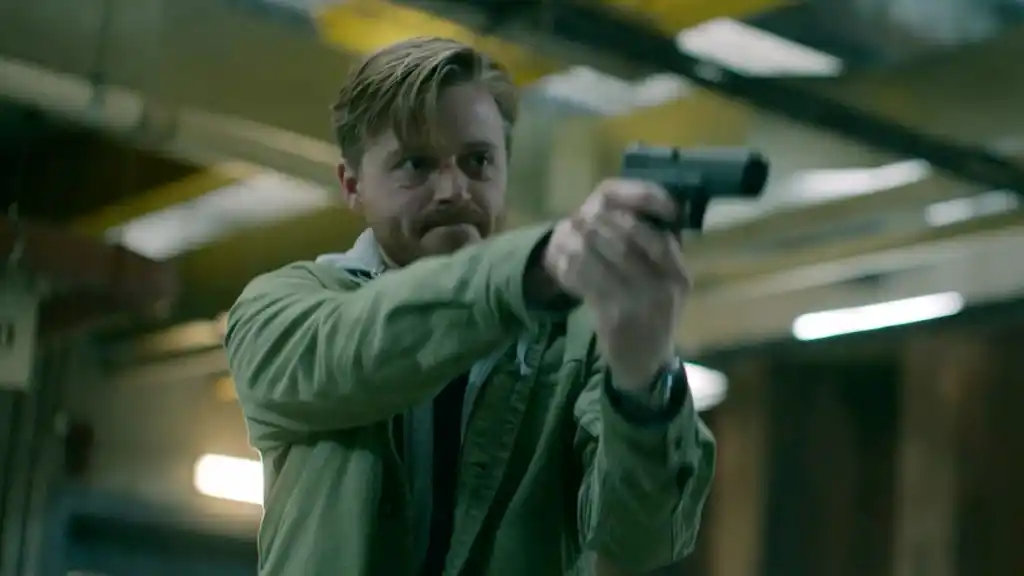 River Cartwright pointing a gun in Slow Horses season 2