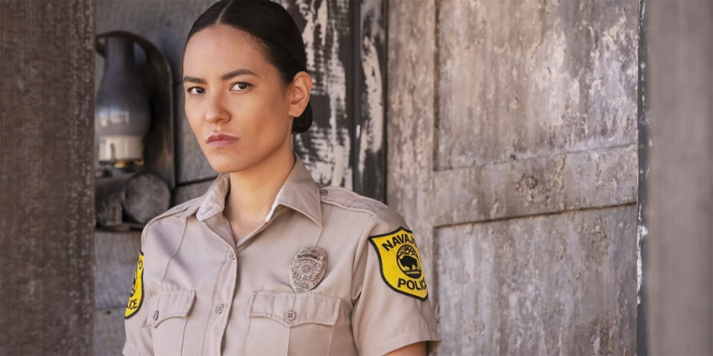 Bernadette Manuelito stands by a wall outside in Dark Winds