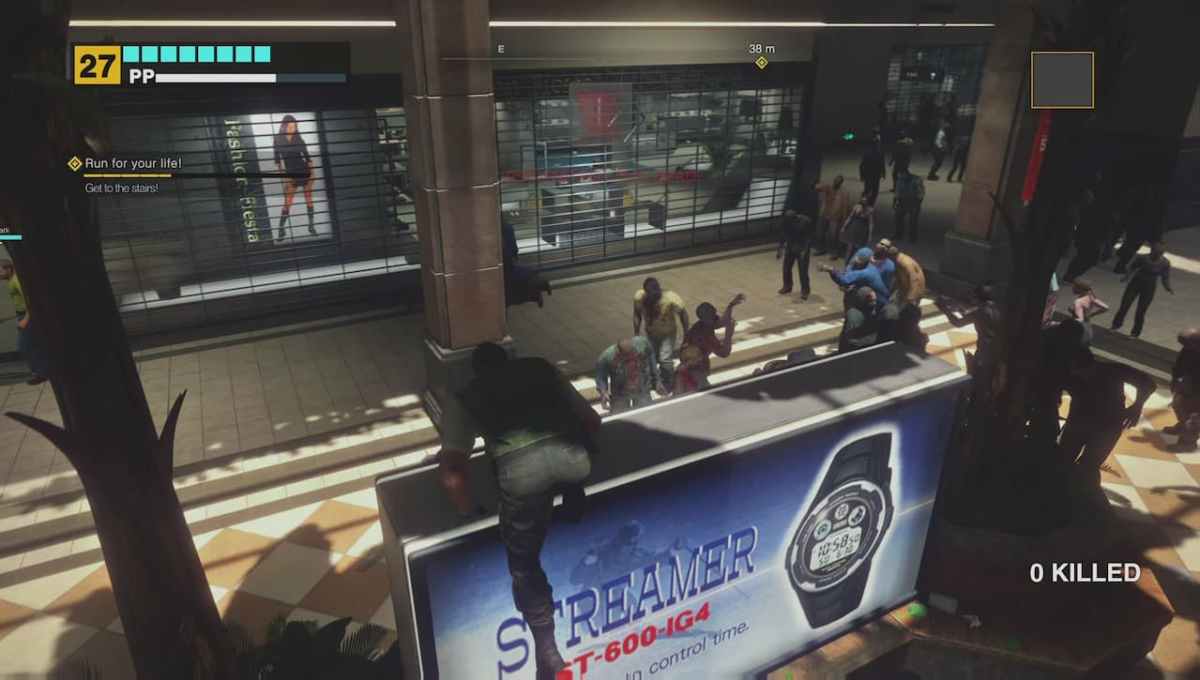 Frank West in Dead Rising Deluxe Remaster, climbing a billboard. 