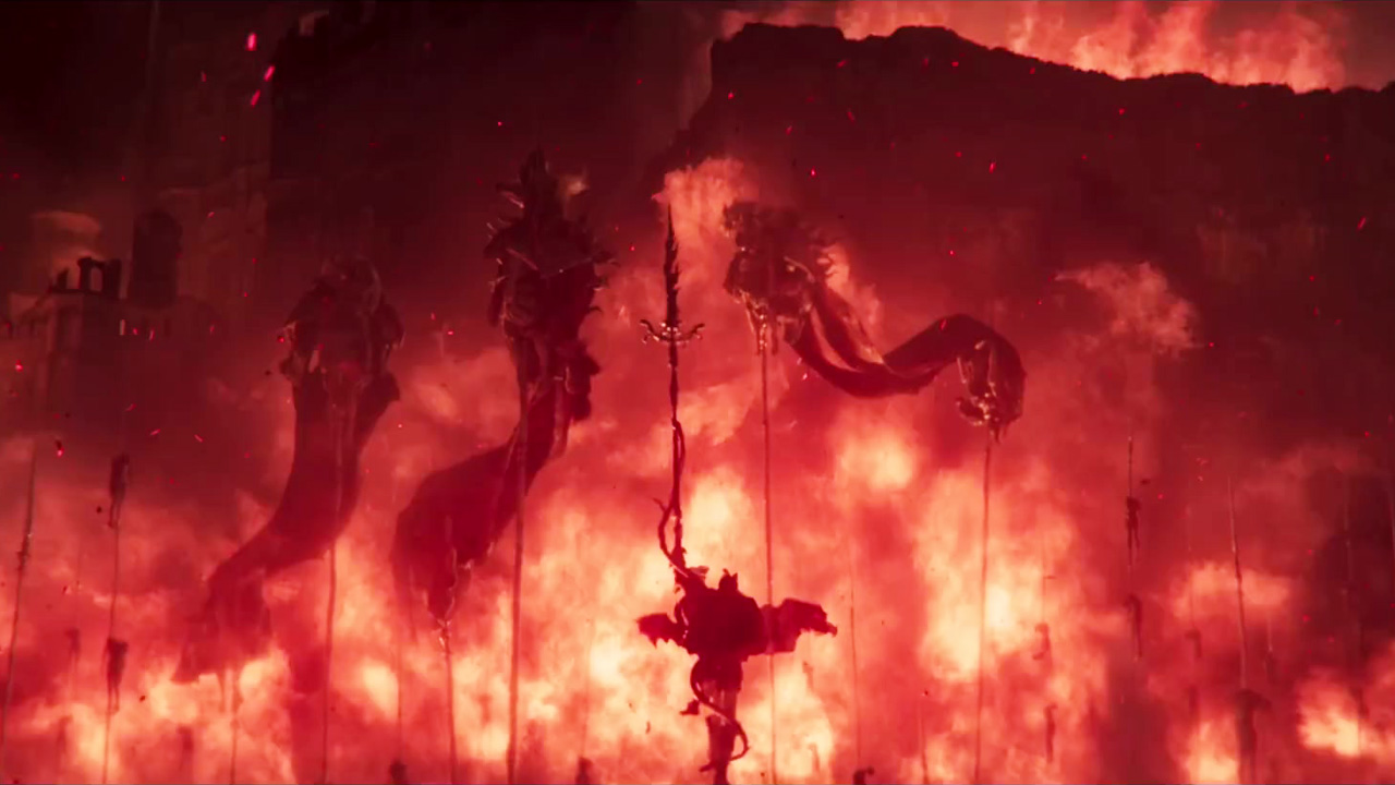 Elden Ring, a character standing in front of a huge wall of flames.