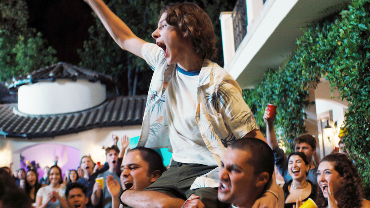 Netflix's Incoming, a teenager being held aloft at a party.