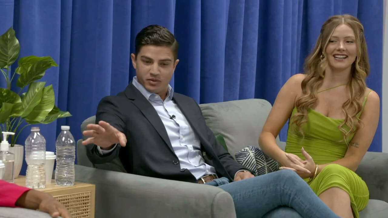 Kara and Guillermo in 90 Day Fiance, sitting on a sofa at the reunion.