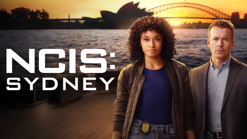 The leads of NCIS: Sydney in front of the Sydney Opera House