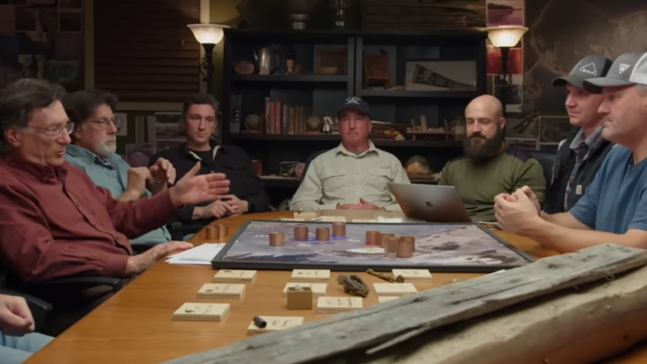 The Curse of Oak Island, the cast sitting around a table.