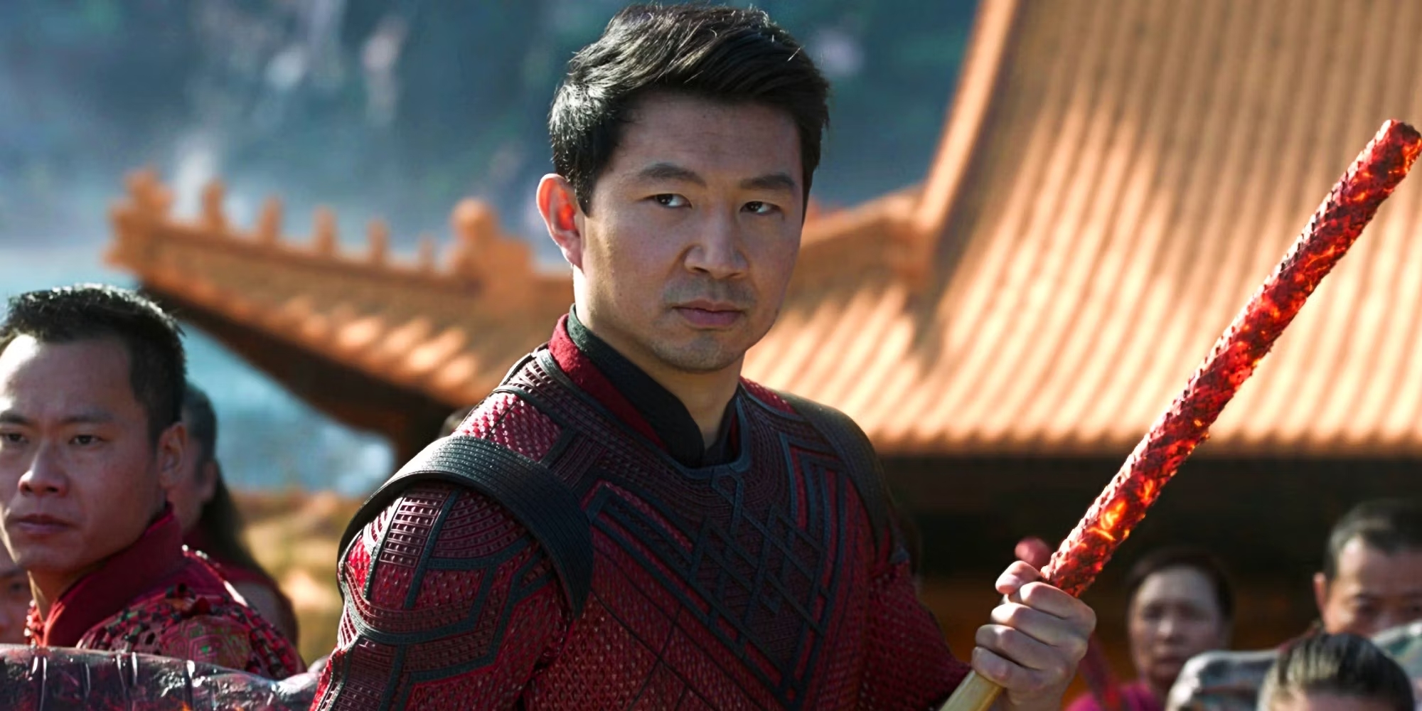 Shang-Chi holds a staff