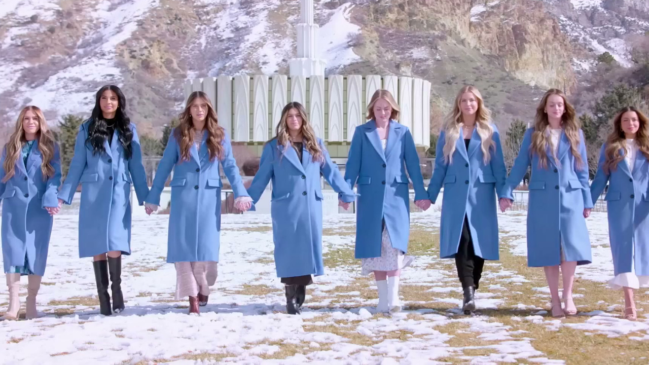 The Secret Lives of Mormon Wives, the cast walking along all wearing blue coats.