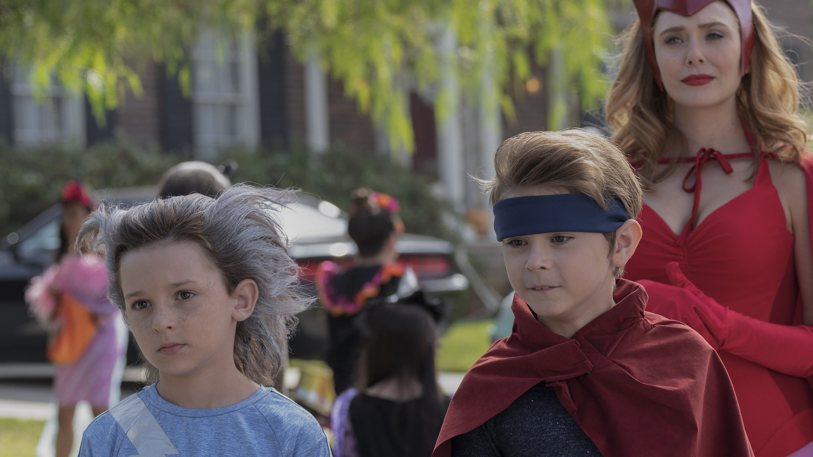 Tommy, Billy, and Wanda Maximoff wearing comics-inspired costumes in WandaVision