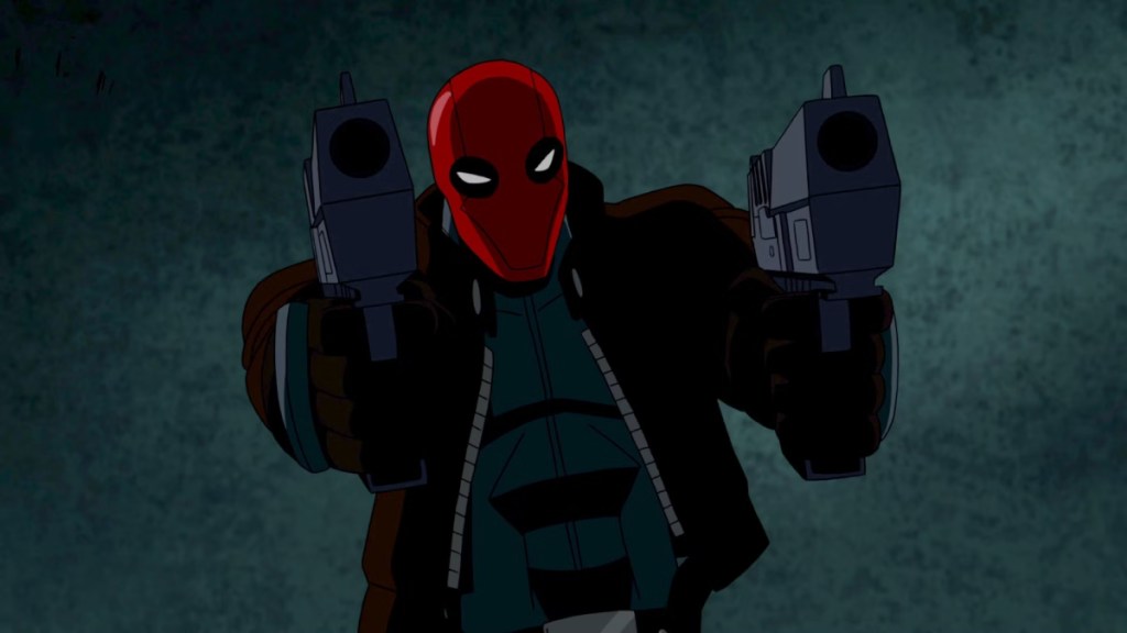 Red Hood aims two pistols as part of an article about the best DC animated movies.