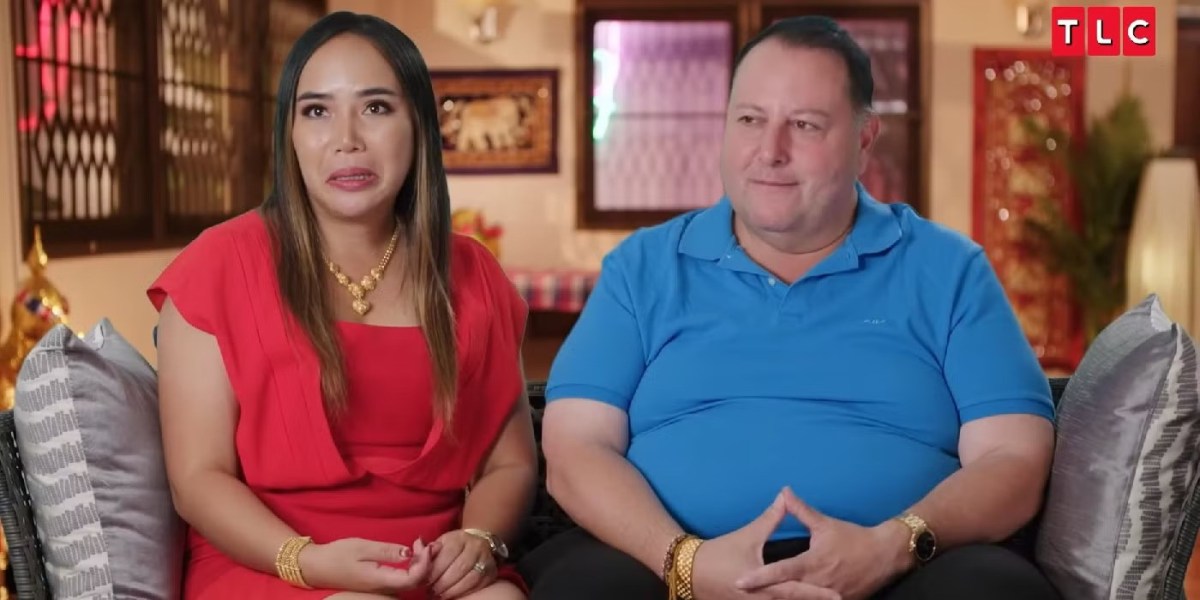 David and Annie from 90 Day Fiance sitting down.