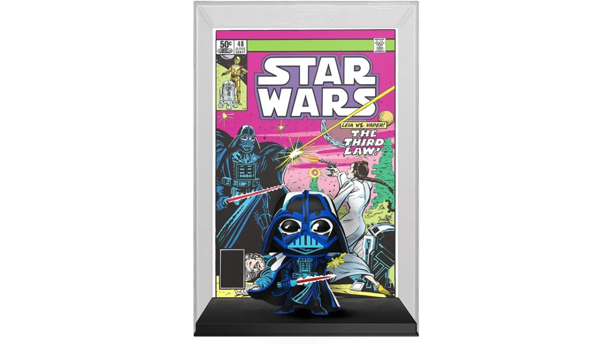 A Darth Vader Funko Pop in front of a comic image of the character. 