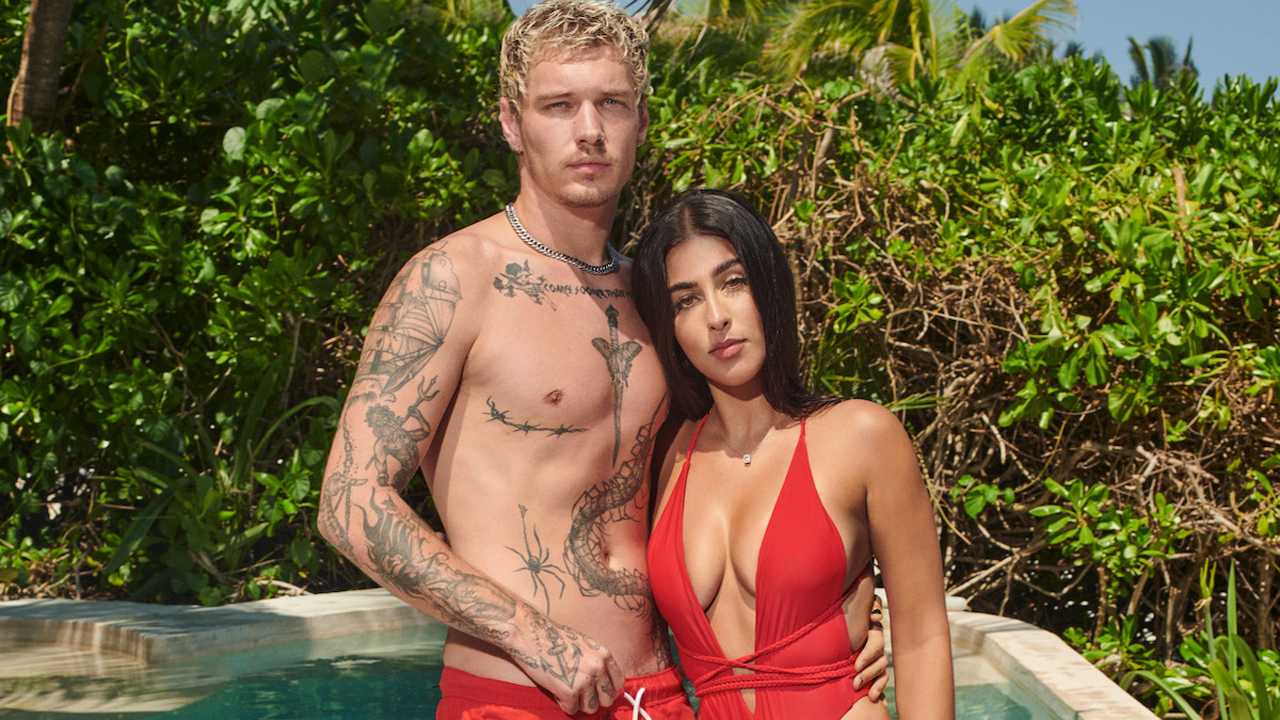 Stevan and Alara from Perfect Match, standing by a pool.