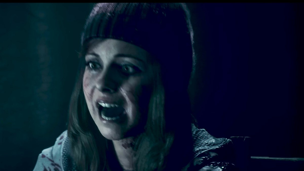 Ashley in Until Dawn, wearing a wool hat, screaming. 