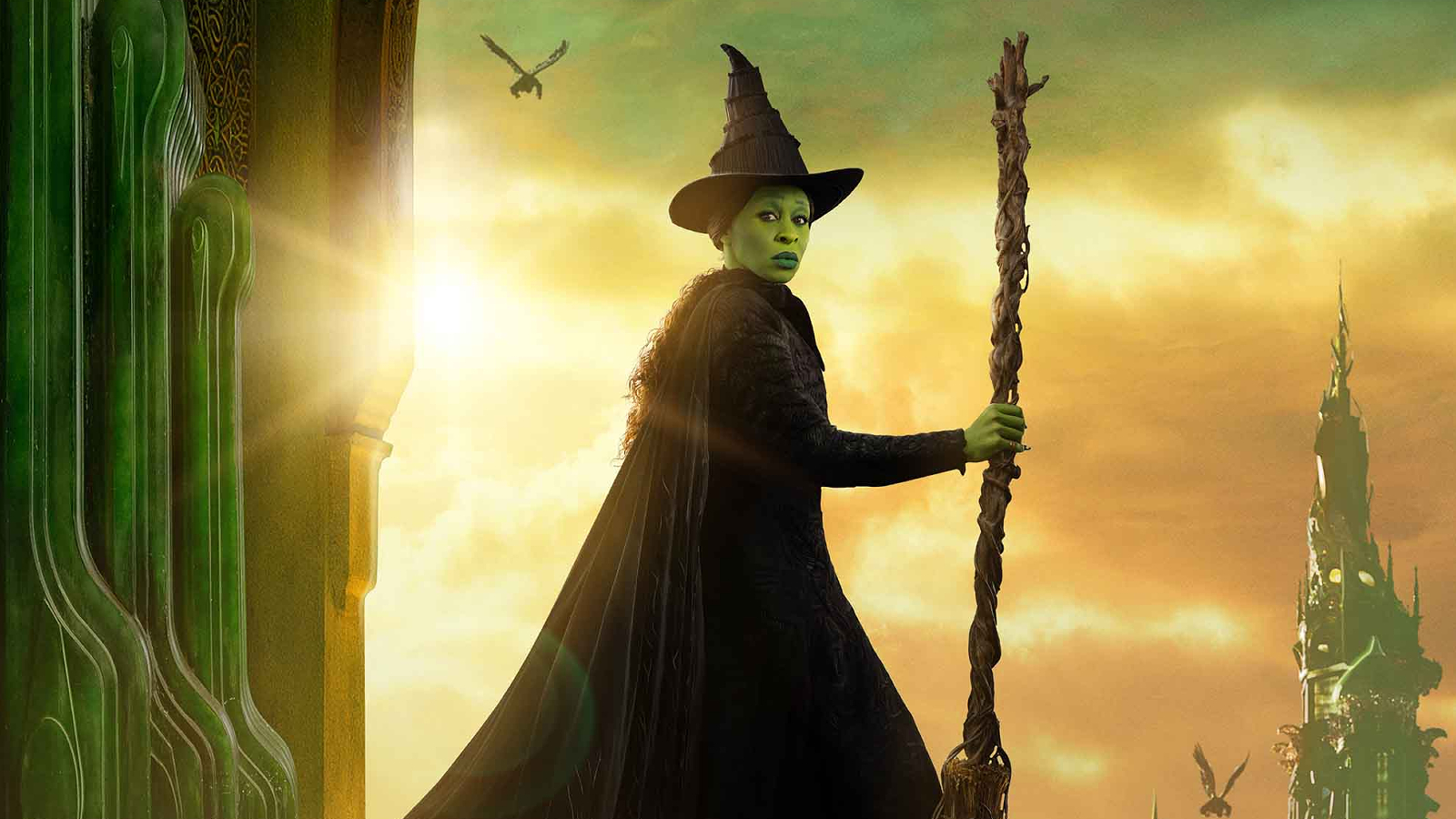 Elphaba holding her broom in cropped key art for Wicked: Part One