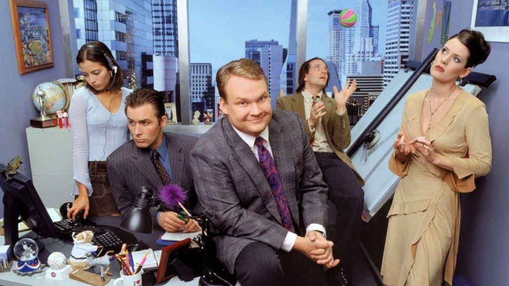 The main cast of Andy Richter Controls the Universe in an office