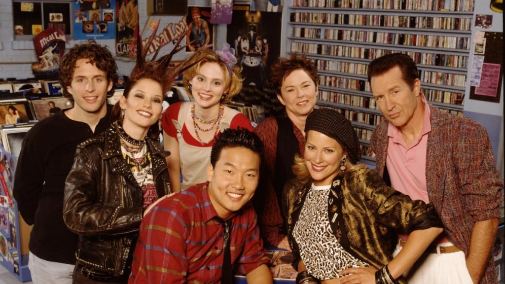 The cast of That '80s Show in a record store