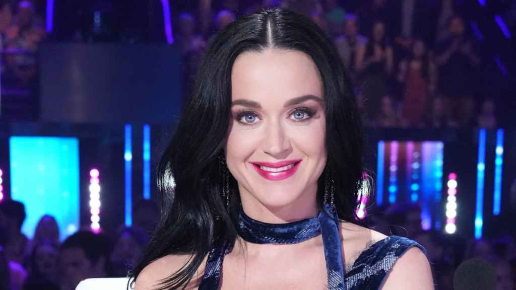 Katy Perry Smiling on American Idol as part of an article about conspiracy theories.