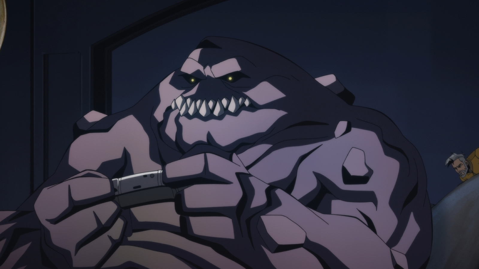 Clayface gaming on the couch in Creature Commandos Season 1, Episode 5