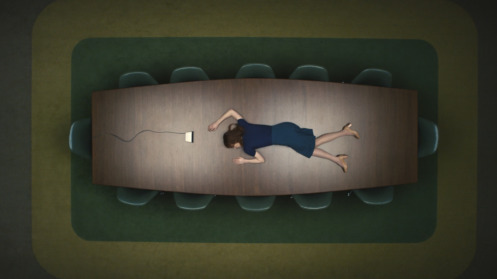 Helly unconscious on a boardroom table in Severance Season 1, Episode 1