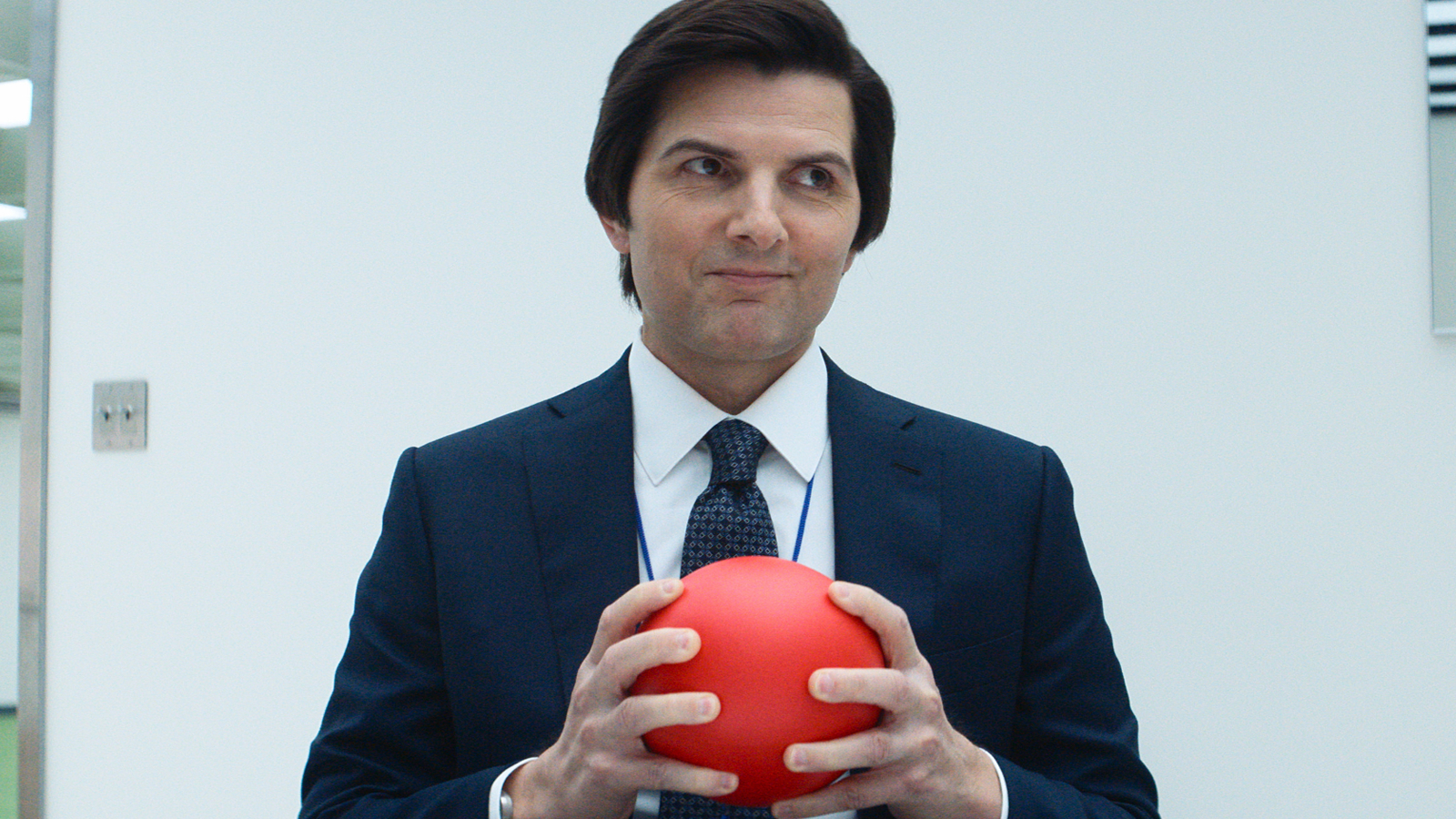 Mark Scout holding a red ball in Severance Season 2